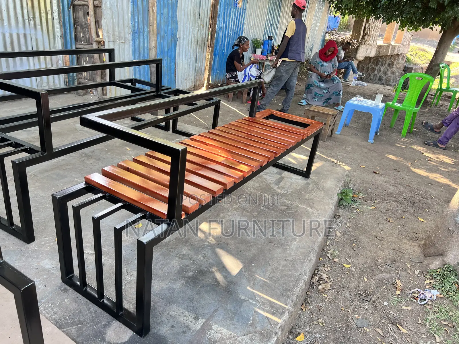 Modern Outdoor Bench With a Metal Frame and Wooden Slats