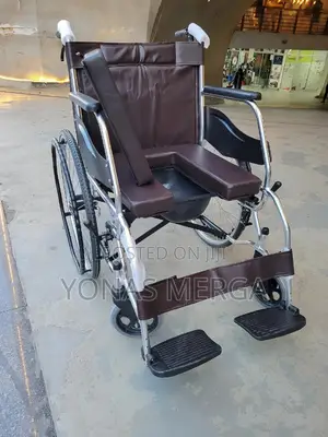 Toilet Wheelchair增琳image Shows a New, Standard Manual Wheelchair.
