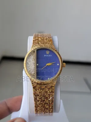 Gold Rolex Watch With a Blue Dial and Diamond