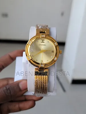 A Gold-Toned Chanel Women's Watch With a Braided Metal Band