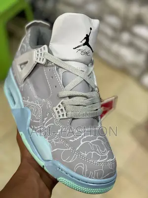 Air Jordan 4 Retro Kaws Sneakers in Cool Grey.
