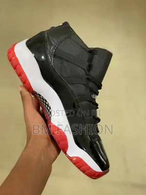 Nike Air Jordan 11 Retro "Bred" Sneakers.