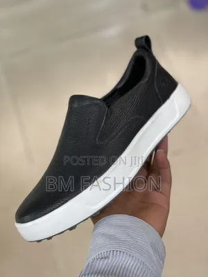 Rockport Men's Total Motion Lite Slip-on Sneaker in Black Leather